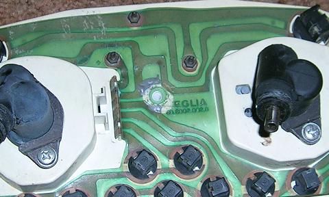 [The circuit board after I pulled off the rubber bumper and scraped off most of the JB Weld.]